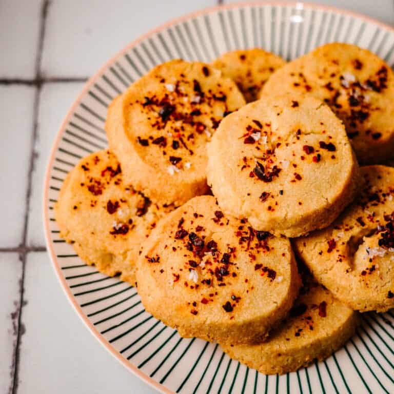 A plate of parmesan and chilli shortbread biscuits.